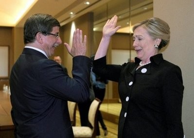 AFP - US Secretary of State Hillary Clinton (R) gives Turkey's Foreign Minister Ahmet Davutoglu a high five during a meeting on the sidelines of the third meeting of the International contact group on Libya AFP - US Secretary of State Hillary Clinton (R) gives Turkey's Foreign Minister Ahmet Davutoglu a high five during a meeting on the sidelines of the third meeting of the International contact group on Libya