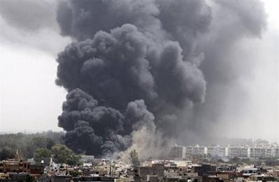 Smoke rises after coalition air strikes in Tripoli June 7, 2011 Smoke rises after coalition air strikes in Tripoli June 7, 2011