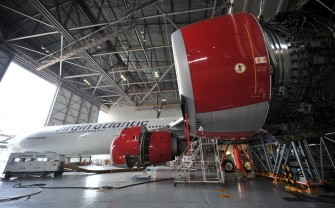 This photo taken on May 26, 2011 shows a passenger plane of Britain-based Virgin Atlantic airlines being repaired at the hangar of Lufthansa Technik Philippines in Manila. AFP This photo taken on May 26, 2011 shows a passenger plane of Britain-based Virgin Atlantic airlines being repaired at the hangar of Lufthansa Technik Philippines in Manila. AFP