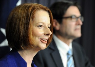 AFP - Australia Prime Minister Julia Gillard (L) presents the government's carbon emissions fact sheets as Greg Combet (R), the Minister for Climate Change, looks on at Parliament House in Canberra on June 14, 2011. AFP - Australia Prime Minister Julia Gillard (L) presents the government's carbon emissions fact sheets as Greg Combet (R), the Minister for Climate Change, looks on at Parliament House in Canberra on June 14, 2011.