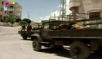 An image grab taken from footage broadcast by the Syrian state television on June 14 shows Syrian troops deployed in the flashpoint town of Jisr al-Shughur. An image grab taken from footage broadcast by the Syrian state television on June 14 shows Syrian troops deployed in the flashpoint town of Jisr al-Shughur.