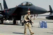 File photo of a US Marine standing guard in front of an F-15 fighter jet. File photo of a US Marine standing guard in front of an F-15 fighter jet.