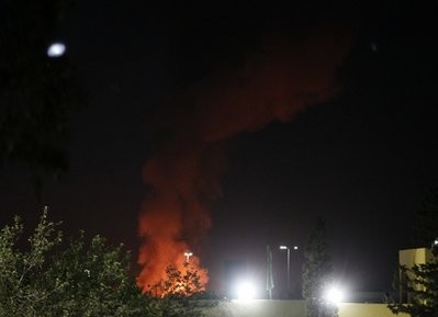 A plume of smoke and fire is seen after an airstrike in Tripoli, Libya, on Tuesday, June 14, 2011 A plume of smoke and fire is seen after an airstrike in Tripoli, Libya, on Tuesday, June 14, 2011
