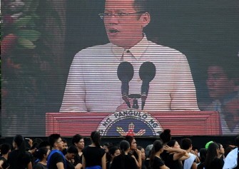 AFP - Student performers watch at the projector as Philippine President Benigno Aquino delivers his speech during the celebration of the 113th anniversary of the proclamation of Philippine Independence at the Quirino Grand stand in Manila on June 12, 2011. AFP - Student performers watch at the projector as Philippine President Benigno Aquino delivers his speech during the celebration of the 113th anniversary of the proclamation of Philippine Independence at the Quirino Grand stand in Manila on June 12, 2011.
