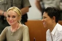 AFP File picture shows Lindsay Lohan with her lawyer Shawn Chapman Holley (R) at a court proceeding in LA AFP File picture shows Lindsay Lohan with her lawyer Shawn Chapman Holley (R) at a court proceeding in LA