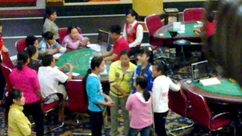 The file photo shows Vietnamese gamblers at a casino in neighboring Cambodia. The file photo shows Vietnamese gamblers at a casino in neighboring Cambodia.