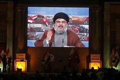 Lebanon's Hezbollah leader Sayyed Hassan Nasrallah addresses his supporters through a giant screen to express solidarity with the Arab uprisings and in support of their sacrifices, during a rally in Beirut's suburb, March 19, 2011 Lebanon's Hezbollah leader Sayyed Hassan Nasrallah addresses his supporters through a giant screen to express solidarity with the Arab uprisings and in support of their sacrifices, during a rally in Beirut's suburb, March 19, 2011