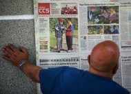 Supporters of Venezuelan President Hugo Chavez watch the television broadcast of Venezuelan President Hugo Chavez's medical condition Supporters of Venezuelan President Hugo Chavez watch the television broadcast of Venezuelan President Hugo Chavez's medical condition
