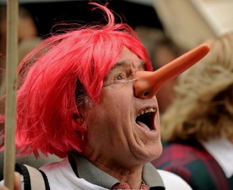 AFP - A protester wears a 'Pinocchio' style nose and a red wig during a rally in Sydney on July 1, 2011 against red-headed Australian Prime Minister Julia Gillard's plans to introduce a carbon tax. AFP - A protester wears a 'Pinocchio' style nose and a red wig during a rally in Sydney on July 1, 2011 against red-headed Australian Prime Minister Julia Gillard's plans to introduce a carbon tax.