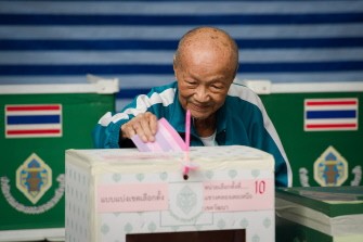 AFP - An elderly man casts his vote at a polling station set up at the Sawadee school in Bangkok on July 3, 2011. AFP - An elderly man casts his vote at a polling station set up at the Sawadee school in Bangkok on July 3, 2011.