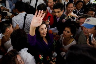 AFP - Yingluck Shinawatra waves to the crowd as she arrives at her party headquarters in Bangkok on July 3, 2011. AFP - Yingluck Shinawatra waves to the crowd as she arrives at her party headquarters in Bangkok on July 3, 2011.
