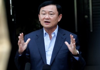 AFP - Thai former premier Thaksin Shinawatra gestures during a briefing in Dubai on July 4, 2011. AFP - Thai former premier Thaksin Shinawatra gestures during a briefing in Dubai on July 4, 2011.