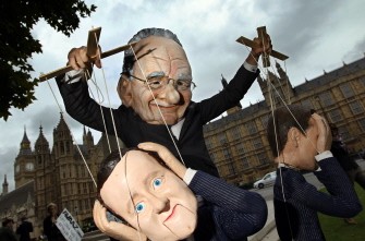 AFP - A demonstrator dressed in a Rupert Murdoch mask controls puppets of British Prime Minister David Cameron (Foreground) and British Minister for Culture, Media and Sport Jeremy Hunt, (R) during a protest against Murdoch's proposed takeover of BSkyB, in London, on July 8, 2011 AFP - A demonstrator dressed in a Rupert Murdoch mask controls puppets of British Prime Minister David Cameron (Foreground) and British Minister for Culture, Media and Sport Jeremy Hunt, (R) during a protest against Murdoch's proposed takeover of BSkyB, in London, on July 8, 2011