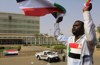 AFP - A Sudanese man waves his national flag in Khartoum on July 9, 2011 hours before South Sudan officially declares independence from the north. AFP - A Sudanese man waves his national flag in Khartoum on July 9, 2011 hours before South Sudan officially declares independence from the north.