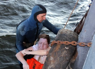 AFP - A handout photo provided on July 11, 2011 by Russia’s Republic of Tatarstan Emergencies Ministry shows a diver lifting on July 11 a victim of the Bulgaria river cruise ship AFP - A handout photo provided on July 11, 2011 by Russia’s Republic of Tatarstan Emergencies Ministry shows a diver lifting on July 11 a victim of the Bulgaria river cruise ship