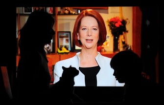 Heidrun Blackwood (L) and her son Coen (R) and cat Honey (C) watch the address to the nation by Australian Prime Minister Julia Gillard in Sydney on July 10, 2011. Heidrun Blackwood (L) and her son Coen (R) and cat Honey (C) watch the address to the nation by Australian Prime Minister Julia Gillard in Sydney on July 10, 2011.