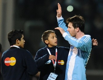 Lionel Messi greets children at the end of the match against Costa Rica. AFP Lionel Messi greets children at the end of the match against Costa Rica. AFP