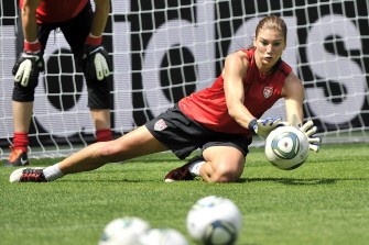 AFP - USA goalkeeper Hope Solo saves a ball during a training session at the Borussia-Park stadium in Moenchengladbach on July 12, 2011. USA faces France in the semi final-match in Moenchengladbach on July 13, 2011. AFP - USA goalkeeper Hope Solo saves a ball during a training session at the Borussia-Park stadium in Moenchengladbach on July 12, 2011. USA faces France in the semi final-match in Moenchengladbach on July 13, 2011.