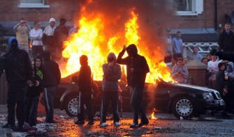 AFP - A car is set alight as Nationalist Youths throw rocks and petrol bombs at Police during rioting in Belfast, Northern Ireland, on July 12, 2011 AFP - A car is set alight as Nationalist Youths throw rocks and petrol bombs at Police during rioting in Belfast, Northern Ireland, on July 12, 2011