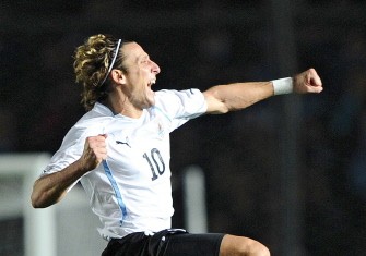 AFP - Uruguayan forward Diego Forlan celebrates after teammate Martin Caceres (out of frame) scored the final penalty kick to beat Argentina AFP - Uruguayan forward Diego Forlan celebrates after teammate Martin Caceres (out of frame) scored the final penalty kick to beat Argentina
