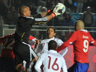 AFP - Venezuelan goalkeeper Renny Vega (L) jumps to catch the ball during the quarter-final football match on July 17, 2011. AFP - Venezuelan goalkeeper Renny Vega (L) jumps to catch the ball during the quarter-final football match on July 17, 2011.
