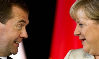 AFP - Russian President Dmitry Medvedev (L) and German Chancellor Angela Merkel talk during a signature session during the 13th annual German-Russian cabinet meeting at the Herrenhaeuser Gardens in Hanover, northern Germany, on July 19, 2011. AFP - Russian President Dmitry Medvedev (L) and German Chancellor Angela Merkel talk during a signature session during the 13th annual German-Russian cabinet meeting at the Herrenhaeuser Gardens in Hanover, northern Germany, on July 19, 2011.
