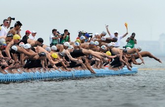 AFP - Competitors dive in at the start of the men's 5km open water swimming event of the FINA World Championships at Jinshan beach in Shanghai on July 22, 2011. AFP - Competitors dive in at the start of the men's 5km open water swimming event of the FINA World Championships at Jinshan beach in Shanghai on July 22, 2011.