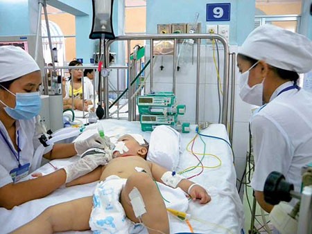 Doctors examine an infected child in the Children Hospital No.1 Doctors examine an infected child in the Children Hospital No.1