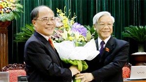 Newly-appointed National Assembly chairman Nguyen Sinh Hung (left) gives flowers to his predecessor Nguyen Phu Trong as the appointment was announced Saturday Newly-appointed National Assembly chairman Nguyen Sinh Hung (left) gives flowers to his predecessor Nguyen Phu Trong as the appointment was announced Saturday