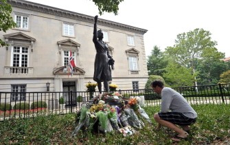 AFP - A man pays his respects after laying flowers at the foots of a statue of Norwegian Crown Princess Martha, mother of current King Harald V, in front of the Norwegian embassy in Washington on July 24, 2011. AFP - A man pays his respects after laying flowers at the foots of a statue of Norwegian Crown Princess Martha, mother of current King Harald V, in front of the Norwegian embassy in Washington on July 24, 2011.