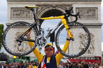 AFP - Yellow jersey of overall leader, Cadel Evans, lifts his bicycle in front of the Arc de Triomphe during the parade on the famous Champs-Elysees avenue in Paris after he won the 2011 Tour de France cycling race on July 24, 2011 AFP - Yellow jersey of overall leader, Cadel Evans, lifts his bicycle in front of the Arc de Triomphe during the parade on the famous Champs-Elysees avenue in Paris after he won the 2011 Tour de France cycling race on July 24, 2011