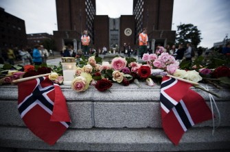AFP - Oslo's town hall is decorated with flowers by some of the 150,000 people who gathered for a flower vigil on July 25, 2011 in Olso AFP - Oslo's town hall is decorated with flowers by some of the 150,000 people who gathered for a flower vigil on July 25, 2011 in Olso