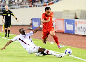 Winger Trong Hoang (in red) races past Qatar’s defender Mohamed Musa Winger Trong Hoang (in red) races past Qatar’s defender Mohamed Musa