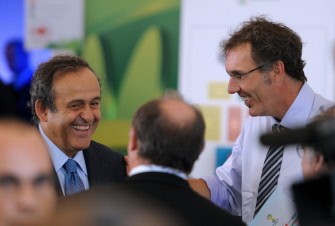 AFP - FIFA's vice-president Michel Platini (L) laughs with France coach Laurent Blanc on July 30, 2011, at Marina da Gloria, Rio de Janeiro, Brazil, before attending the Preliminary Draw AFP - FIFA's vice-president Michel Platini (L) laughs with France coach Laurent Blanc on July 30, 2011, at Marina da Gloria, Rio de Janeiro, Brazil, before attending the Preliminary Draw