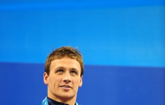 AFP- Ryan Lochte smiles on the podium during the award ceremony for the final of the men's 400-metre individual medley swimming AFP- Ryan Lochte smiles on the podium during the award ceremony for the final of the men's 400-metre individual medley swimming