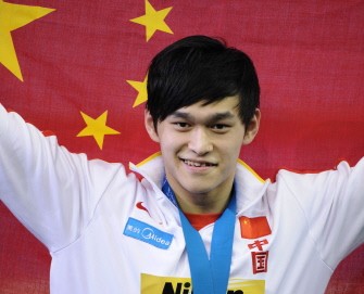 AFP - Sun Yang smiles during the award ceremony AFP - Sun Yang smiles during the award ceremony