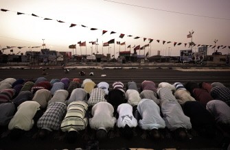 Libyan men perform the evening prayer at the end of the first fasting day of Islam's holy month of Ramadan in the rebel stronghold of Benghazi on August 1,2011. Libyan men perform the evening prayer at the end of the first fasting day of Islam's holy month of Ramadan in the rebel stronghold of Benghazi on August 1,2011.