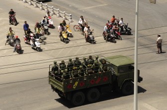 This file photo taken on July 10, 2009 shows trucks full of Chinese soldiers patrolling the streets of Kashgar, in China's farwest Xinjiang region after some of the worst deadly ethnic violence in decades hit the province This file photo taken on July 10, 2009 shows trucks full of Chinese soldiers patrolling the streets of Kashgar, in China's farwest Xinjiang region after some of the worst deadly ethnic violence in decades hit the province