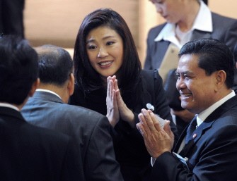 AFP - Yingluck Shinawatra (C) gives a traditional greeting to members of parliament as they attend the vote for a house speaker in parliament in Bangkok on August 2, 2011 AFP - Yingluck Shinawatra (C) gives a traditional greeting to members of parliament as they attend the vote for a house speaker in parliament in Bangkok on August 2, 2011