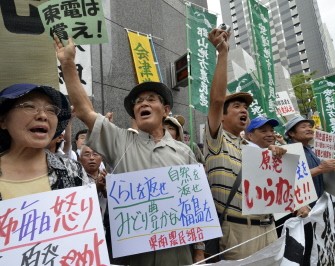 AFP - Farmers from Fukushima prefecture raise their fists in the air to protest at a rally in front of the headquarters of the Tokyo Electric Power Company (TEPCO) in Tokyo on August 3, 2011 AFP - Farmers from Fukushima prefecture raise their fists in the air to protest at a rally in front of the headquarters of the Tokyo Electric Power Company (TEPCO) in Tokyo on August 3, 2011