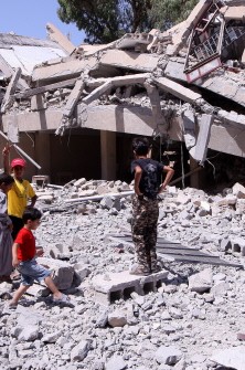 Libyan children stand amid the rubble outside a heavily damaged school in the coastal town of Zliten, 150 kilometres (95 miles) east of Tripoli, which a government official said was destroyed on August 4, 2011 in a NATO air strike earlier in the day Libyan children stand amid the rubble outside a heavily damaged school in the coastal town of Zliten, 150 kilometres (95 miles) east of Tripoli, which a government official said was destroyed on August 4, 2011 in a NATO air strike earlier in the day