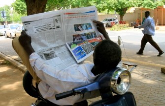 A Sudanese man reads a newspaper as he rests on his moped in the capital Khartoum, on July 31, 2011, as fears of tighter press freedom in the wake of South Sudan's secession are proving justified with several Sudanese newspapers closed this month and numerous journalists on trial. A Sudanese man reads a newspaper as he rests on his moped in the capital Khartoum, on July 31, 2011, as fears of tighter press freedom in the wake of South Sudan's secession are proving justified with several Sudanese newspapers closed this month and numerous journalists on trial.