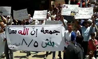 An image grab taken from a video uploaded on YouTube shows Syrian anti-government demonstrators marching in Idlib, northwest of Syria, on August 5, 2011 on the first Friday of Ramadan amid a deadly crackdown on anti-regime protests. An image grab taken from a video uploaded on YouTube shows Syrian anti-government demonstrators marching in Idlib, northwest of Syria, on August 5, 2011 on the first Friday of Ramadan amid a deadly crackdown on anti-regime protests.