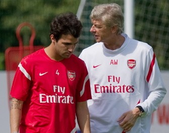 AFP - Arsenal's Spanish player Cesc Fabregas (L) speaks to team manager manager Arsene Wenger during a training session at London Colney on 5 August 2011. AFP - Arsenal's Spanish player Cesc Fabregas (L) speaks to team manager manager Arsene Wenger during a training session at London Colney on 5 August 2011.