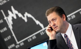 AFP - Stock broker Robert Halver speaks on the phone at the stock exchange in Frankfurt/Main, central Germany, on August 8, 2011. The Frankfurt DAX index of leading shares lost 1.05 percent to 6,170.69 points at the start of trade on August 8, 2011 AFP - Stock broker Robert Halver speaks on the phone at the stock exchange in Frankfurt/Main, central Germany, on August 8, 2011. The Frankfurt DAX index of leading shares lost 1.05 percent to 6,170.69 points at the start of trade on August 8, 2011