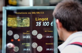AFP - A man looks at prices at a gold wholesale agency, on August 8, 2011 in Paris. AFP - A man looks at prices at a gold wholesale agency, on August 8, 2011 in Paris.