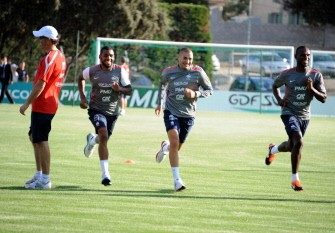 AFP - French national football team players Yann M'Vila (2ndL), French midfielder Karim Benzema (2ndR) and Eric Abidal (R) run during a training session next to French national football team coach Laurent Blanc (L) on August 8, 2011 at the Roger Bambuck Stadium in Baillargues AFP - French national football team players Yann M'Vila (2ndL), French midfielder Karim Benzema (2ndR) and Eric Abidal (R) run during a training session next to French national football team coach Laurent Blanc (L) on August 8, 2011 at the Roger Bambuck Stadium in Baillargues