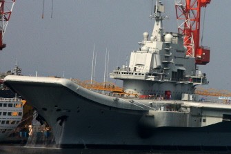 AFP - This photo taken on August 4, 2011 shows China's first aircraft carrier at the port of Dalian AFP - This photo taken on August 4, 2011 shows China's first aircraft carrier at the port of Dalian