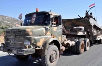 A handout picture from the Syrian Arab News Agency (SANA) shows Syrian soldiers withdrawing on army lorries on August 10, 2011 A handout picture from the Syrian Arab News Agency (SANA) shows Syrian soldiers withdrawing on army lorries on August 10, 2011