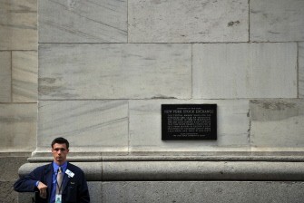 A trader takes a break outside the New York Stock Exchange August 10, 2011 A trader takes a break outside the New York Stock Exchange August 10, 2011